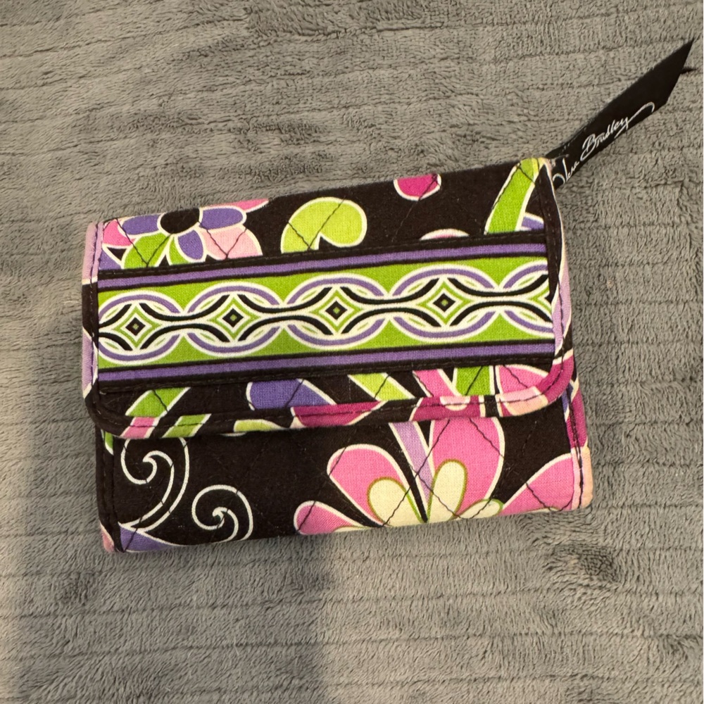 Vera Bradley small wallet looks new out zip pocket. 8 card holder spaces